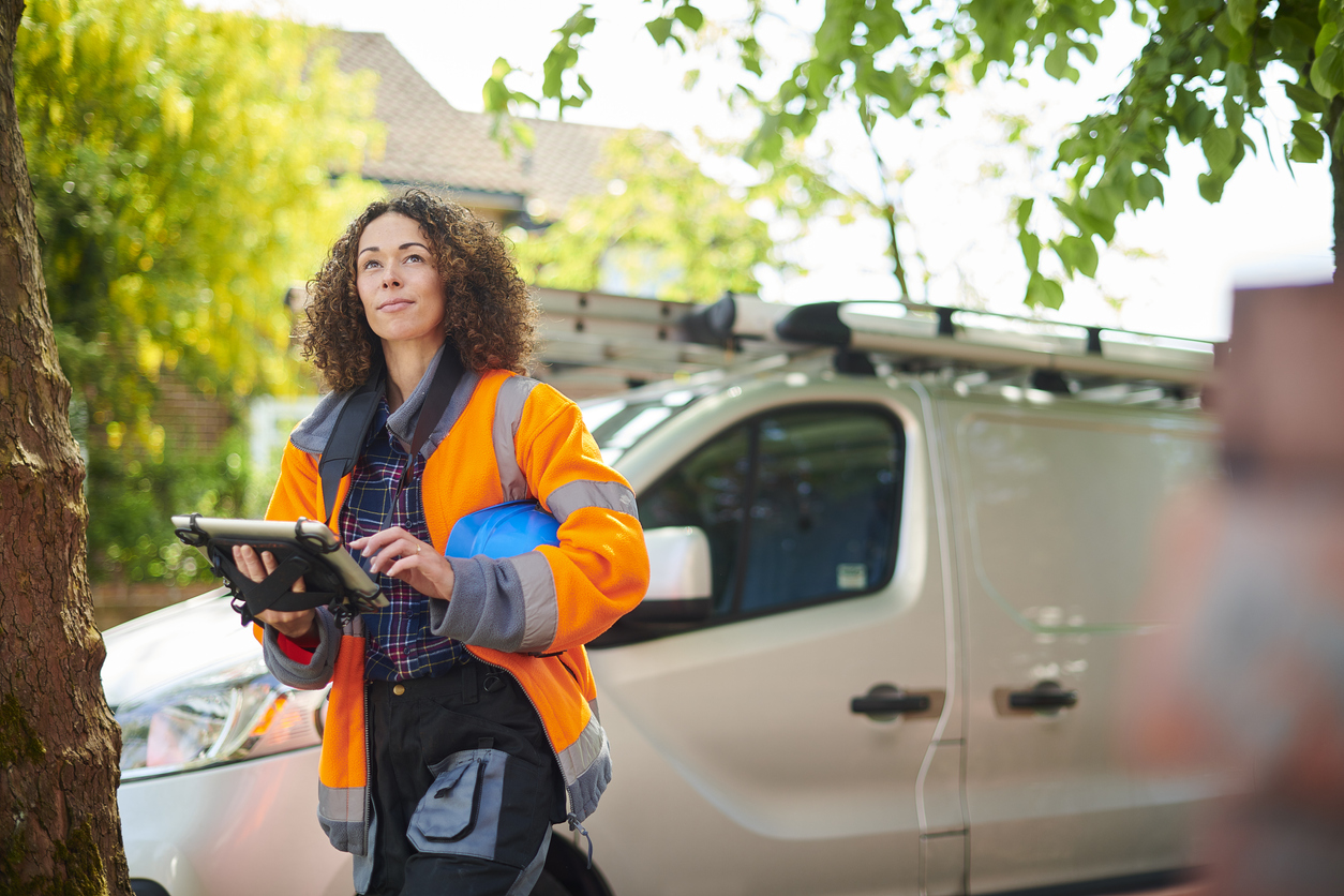 female heating engineer arrives at job Plumber SEO Hero