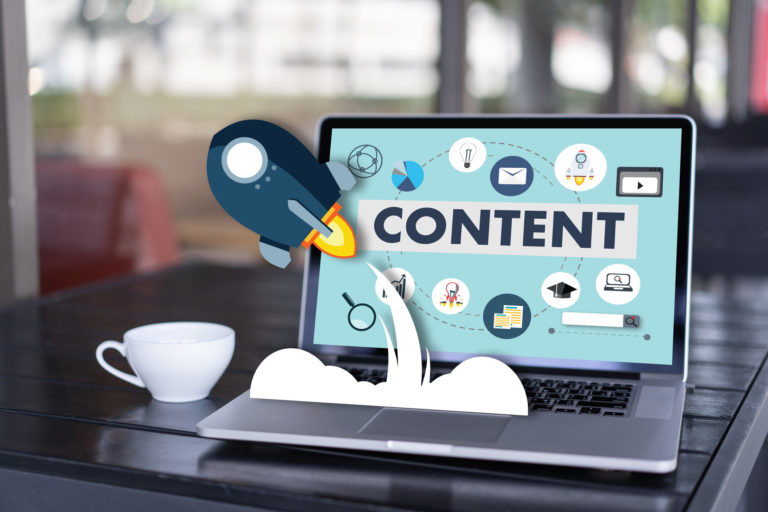 Header for blog. Content marketing on laptop on a desk.