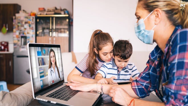 young family using telehealth